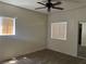 Bright bedroom featuring wood-look flooring, two large windows, and neutral paint at 5170 S Jones Blvd # 108, Las Vegas, NV 89118