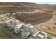 Aerial view of modern homes nestled in a desert landscape with mountain views at 577 Overlook Rim Dr, Henderson, NV 89012