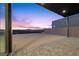 Paved backyard area featuring sunset views at 577 Overlook Rim Dr, Henderson, NV 89012