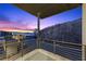 Balcony featuring a beautiful view of the city lights and desert landscape at dusk at 577 Overlook Rim Dr, Henderson, NV 89012