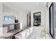 Modern bathroom with a large soaking tub, dual vanities, and a separate shower at 577 Overlook Rim Dr, Henderson, NV 89012