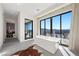 Bathroom with a soaking tub, a view of the shower, and a mountain view at 577 Overlook Rim Dr, Henderson, NV 89012