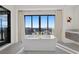 Bright bathroom with a freestanding tub and mountain views through large windows at 577 Overlook Rim Dr, Henderson, NV 89012