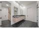 Bright bathroom features double sinks, modern vanity, and access to a walk-in closet at 577 Overlook Rim Dr, Henderson, NV 89012