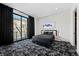 Chic bedroom with modern bed, unique artwork, and expansive window views at 577 Overlook Rim Dr, Henderson, NV 89012