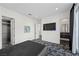 Bright bedroom with a large TV, walk-in closet, and en suite bathroom at 577 Overlook Rim Dr, Henderson, NV 89012