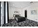 Sleek bedroom features modern art, stylish black bedding, and a walk-in closet at 577 Overlook Rim Dr, Henderson, NV 89012
