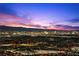 Panoramic night view of Las Vegas showing city lights and mountains at 577 Overlook Rim Dr, Henderson, NV 89012