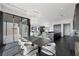 Open-concept design connecting dining and living areas with modern finishes at 577 Overlook Rim Dr, Henderson, NV 89012