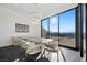 Dining area featuring city views, modern lighting, and stylish decor at 577 Overlook Rim Dr, Henderson, NV 89012