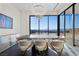 Modern dining room featuring a chandelier, large windows, and city views at 577 Overlook Rim Dr, Henderson, NV 89012