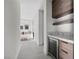 Hallway with a beverage cooler and a view of the bathroom with marble countertops at 577 Overlook Rim Dr, Henderson, NV 89012