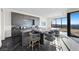 Open kitchen boasts gray cabinets, granite countertops, and island seating at 577 Overlook Rim Dr, Henderson, NV 89012