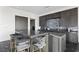 Kitchen with a gray cabinets, island seating and sleek countertops at 577 Overlook Rim Dr, Henderson, NV 89012