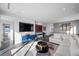 Open concept living room with a TV, bar area, and comfortable seating at 577 Overlook Rim Dr, Henderson, NV 89012