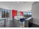 Bright living room boasts floor-to-ceiling windows, modern design, and stylish blue velvet barstools at 577 Overlook Rim Dr, Henderson, NV 89012