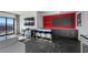 Living room with bar, stools, and a beautiful view from the large windows at 577 Overlook Rim Dr, Henderson, NV 89012