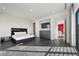 Stylish main bedroom features a plush bed, sleek furniture, and access to a private balcony at 577 Overlook Rim Dr, Henderson, NV 89012