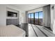 Bright main bedroom boasts floor-to-ceiling windows offering natural light and scenic views at 577 Overlook Rim Dr, Henderson, NV 89012