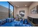 Office with natural light, modern decor, and comfortable blue seating at 577 Overlook Rim Dr, Henderson, NV 89012