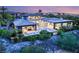 An elevated view showing the home's architectural design, outdoor living spaces, and surrounding mature landscaping at 584 Saint Croix St, Henderson, NV 89012