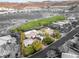Stunning aerial view of a luxury home overlooking a lush green golf course, offering beautiful landscaping and a serene setting at 584 Saint Croix St, Henderson, NV 89012
