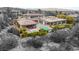 Expansive aerial view of a modern home showcasing a backyard oasis with a sparkling pool and lush landscaping at 584 Saint Croix St, Henderson, NV 89012