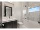 A modern bathroom featuring a shower with glass door and designer tile surround at 584 Saint Croix St, Henderson, NV 89012