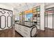 Luxury walk-in closet with custom shelving, drawers, and decorative lighting fixtures at 584 Saint Croix St, Henderson, NV 89012