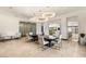 Bright dining room boasts modern chandeliers and views of the outdoors at 584 Saint Croix St, Henderson, NV 89012