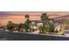 Stunning exterior featuring professional landscaping, mature trees, and a circular driveway at 584 Saint Croix St, Henderson, NV 89012