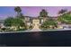 Striking modern home with meticulously landscaped front yard and a grand entrance with mature trees at 584 Saint Croix St, Henderson, NV 89012