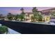 Beautiful modern home showcasing lush landscaping, mature palm trees, and a pristine driveway at 584 Saint Croix St, Henderson, NV 89012