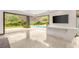 Indoor-outdoor living room featuring a stylish bar area and view of the pool at 584 Saint Croix St, Henderson, NV 89012