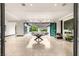 Elegant open living area with unique chandeliers and seamless indoor-outdoor flow to the pool at 584 Saint Croix St, Henderson, NV 89012