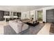 Spacious living room features modern decor, a large sofa, and access to a wine cellar at 584 Saint Croix St, Henderson, NV 89012