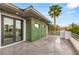 Outdoor patio featuring lush artificial greenery wall and decorative lighting fixtures at 584 Saint Croix St, Henderson, NV 89012
