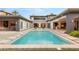 Stunning pool with steps, surrounded by manicured landscaping, and ample space for entertaining at 584 Saint Croix St, Henderson, NV 89012