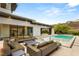Backyard patio featuring a refreshing pool and comfortable lounge furniture perfect for relaxing at 584 Saint Croix St, Henderson, NV 89012