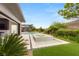 Inviting backyard with a sparkling pool and spa surrounded by lush landscaping and greenery at 584 Saint Croix St, Henderson, NV 89012