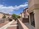 Exterior shot of a lovely community showcasing manicured landscaping and charming homes at 6086 Sunken River Trl, Las Vegas, NV 89118
