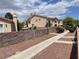 Neighborhood street view showcasing well-kept homes and mature landscaping at 6086 Sunken River Trl, Las Vegas, NV 89118