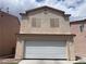 Charming two-story home featuring a spacious two-car garage and neutral color palette at 6086 Sunken River Trl, Las Vegas, NV 89118