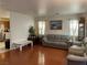 Bright living room with hardwood floors and comfortable seating at 6086 Sunken River Trl, Las Vegas, NV 89118