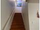 View of a staircase with wood treads and white risers leading up to the next level of the home at 6086 Sunken River Trl, Las Vegas, NV 89118