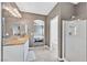 Bright bathroom with double vanity, shower, and toilet at 6717 Lincoln Wood St, Las Vegas, NV 89149