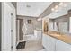 Bathroom with double vanity, open closet, and shower at 6717 Lincoln Wood St, Las Vegas, NV 89149