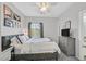 Bedroom with carpet and television at 6717 Lincoln Wood St, Las Vegas, NV 89149