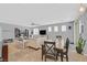 Open layout showcasing a dining area flowing into a cozy living space with modern furnishings at 6717 Lincoln Wood St, Las Vegas, NV 89149