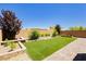 Backyard featuring artificial turf and brick-paved patio at 6730 Pivot Point St, Las Vegas, NV 89148